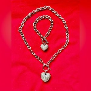 Unmarked stainless steel multi heart pendant jewelry set.